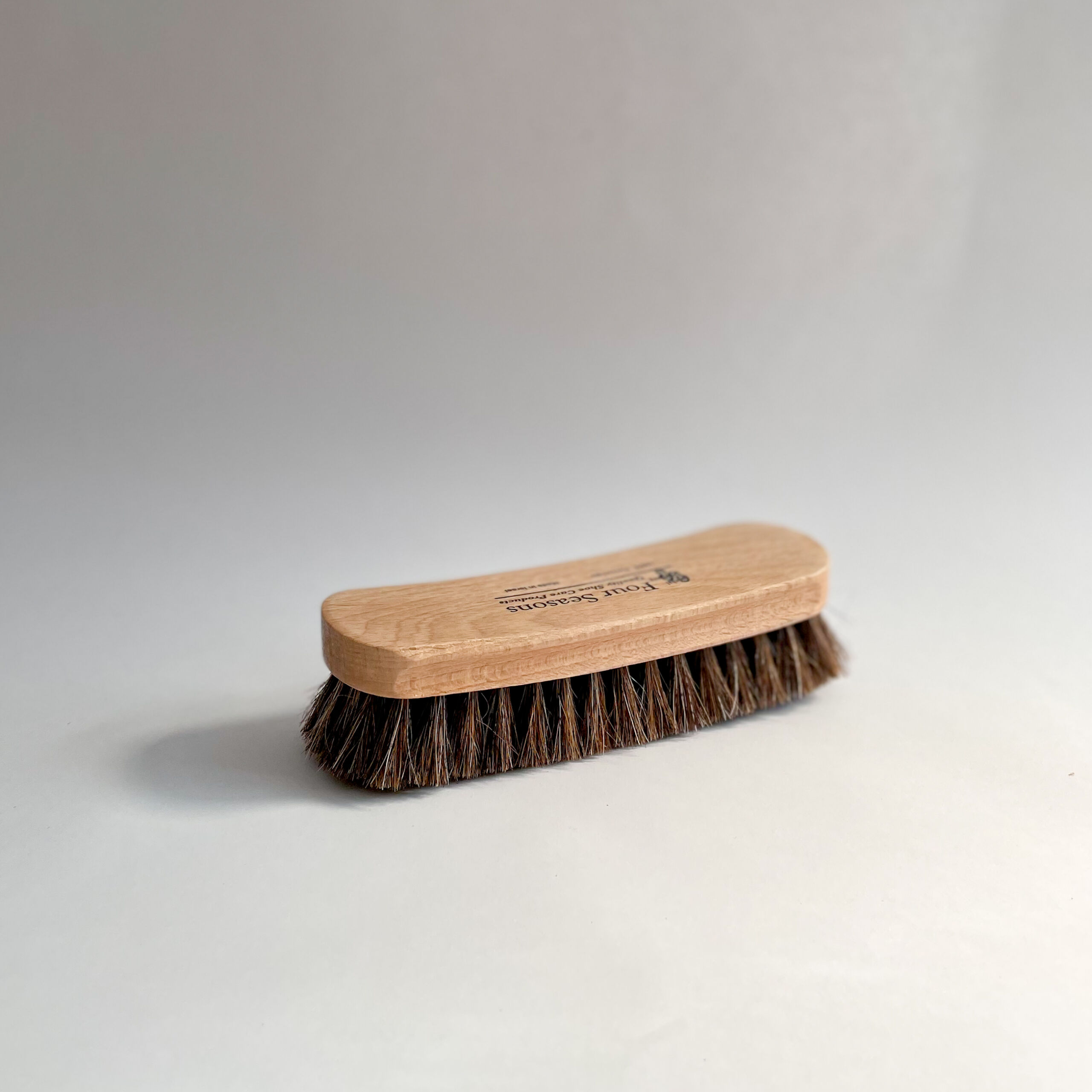 Brown horsehair large buffing brush on white background