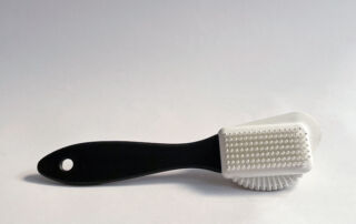 Suede combi brush on white background