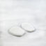 White felt tongue pads on white background